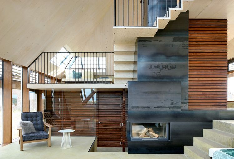 Fireplace and stairs in the Netherlands dune house | House design .