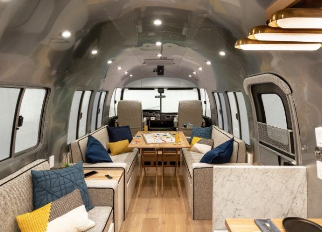 Customized Airstream camper fits seven with room to spare for pop .