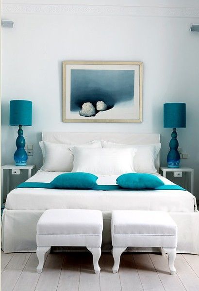 White sheets donned with splashes of teal. Check out the coastal .