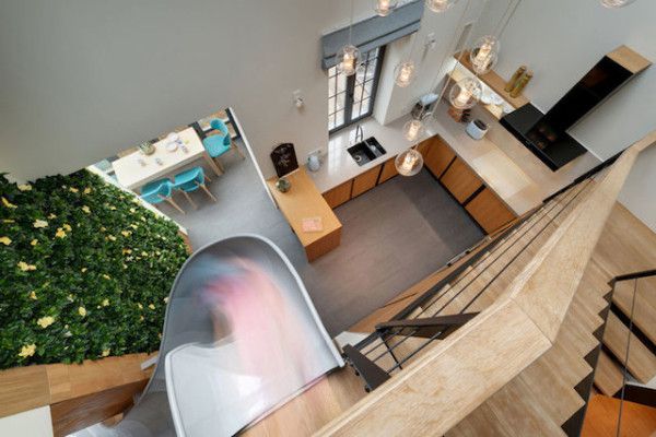 An Apartment With An Indoor Slide Is Living Life To The Fullest .