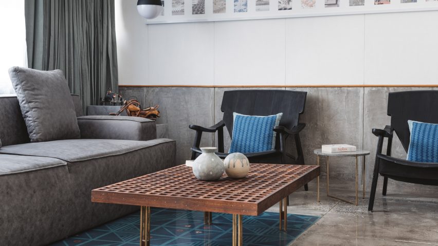 Sāransh combines concrete, blue tiles and teak inside MD Apartme