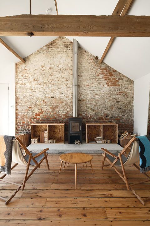 Loving the amount of reclaimed wood used in this modern farmhouse .