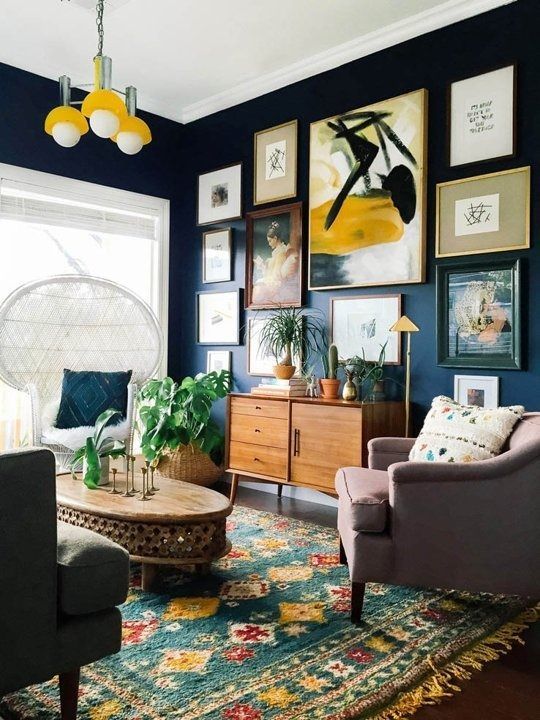 Create a large gallery wall on dark paint to lower intensity in .