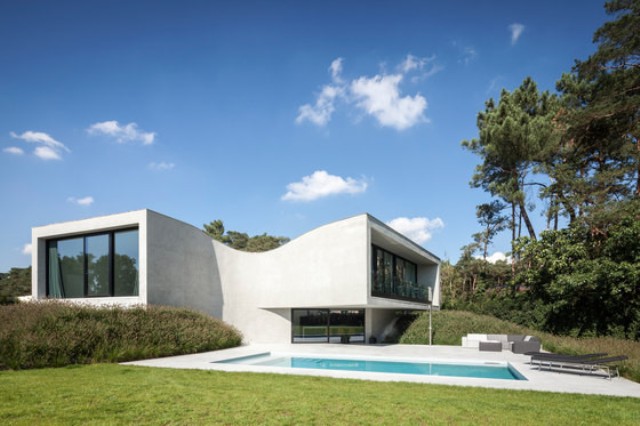 Villa MQ With Unique Sloping Architecture - DigsDi