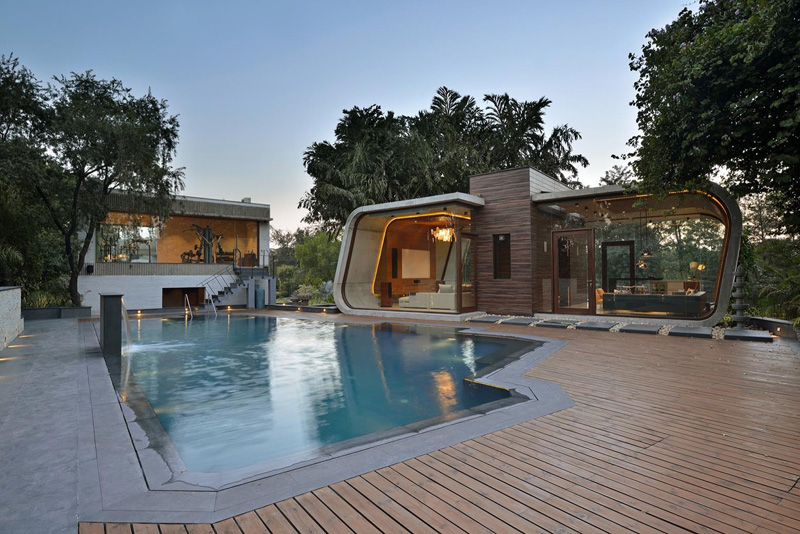 This pool house was built with a curved concrete she