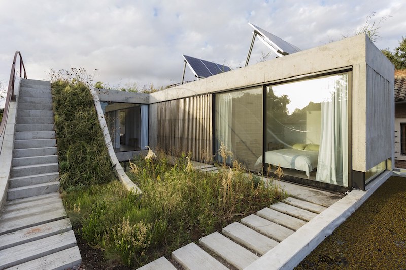 Eco-Friendly House Built Around A Vertical Gard