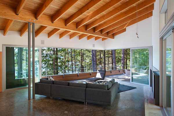 Lake House Design with Open Ceiling Beams and Large Terrace .