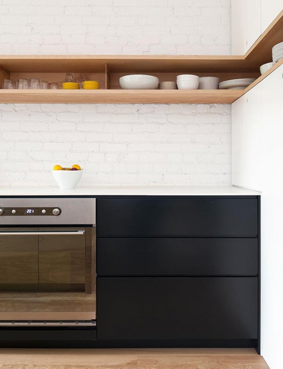 Minimal Black And White Kitchen With A White Brick Wall - DigsDi