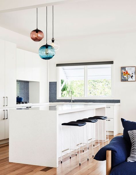 Open kitchen design in this minimalist Australian home .