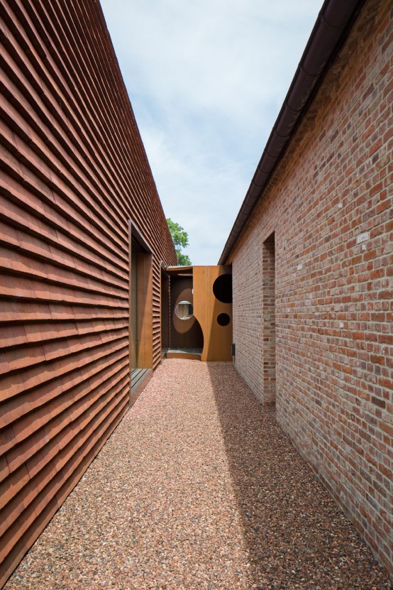 Olmen Farmhouse Covered With Terracotta-Colored Tiles - DigsDi