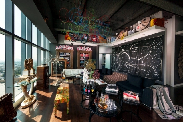 Eclectic furnishings in a stunning luxury apartment penthouse .