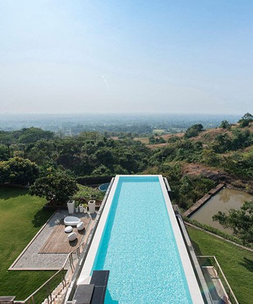 shroffleon designs rooftop infinity pool with uninterrupted views .