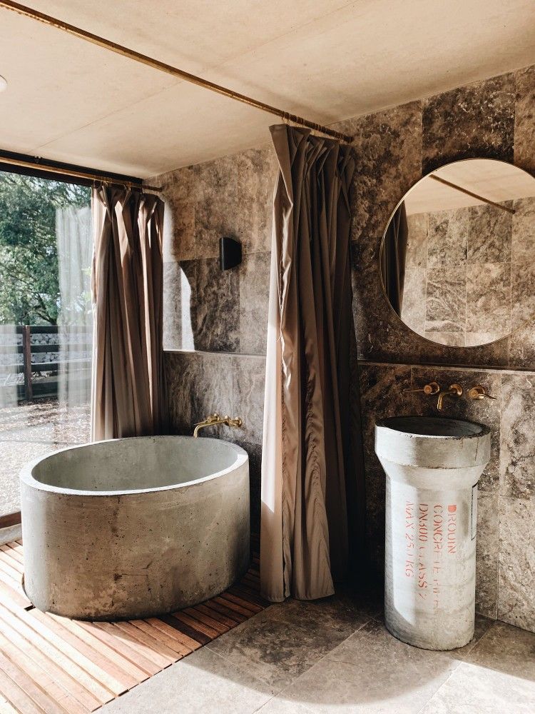 Flat With Concrete Bathtub Modern Living Space Featuring a Sleek Concrete Tub