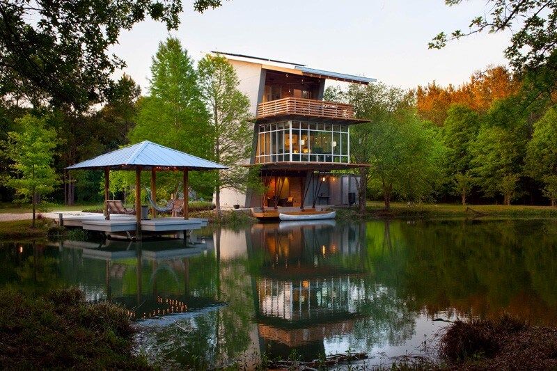 Three Volume Home Around Pond Modern Home Design Surrounding Tranquil Pond