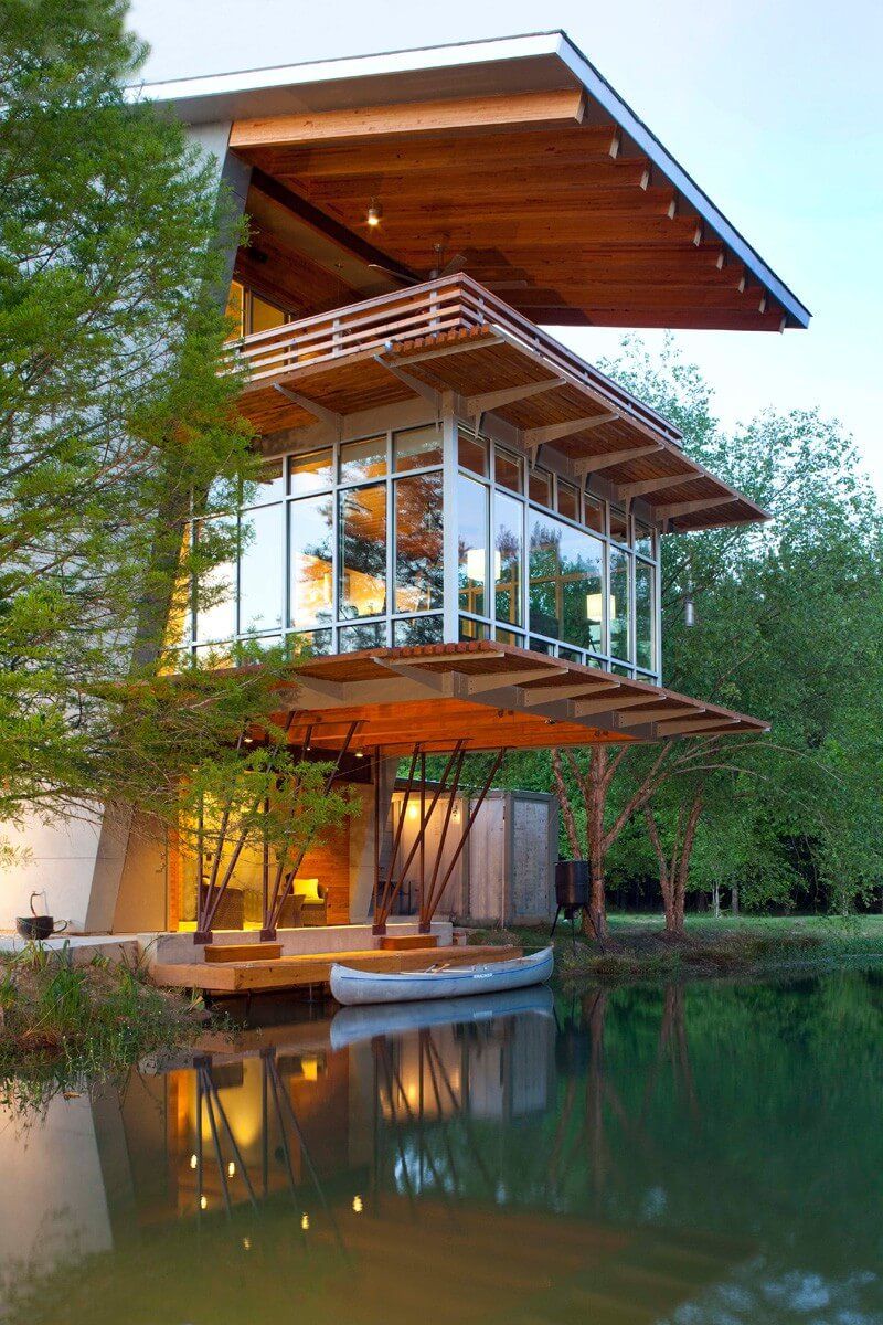 Three Volume Home Around Pond Modern Home Design with Stunning Pond Views