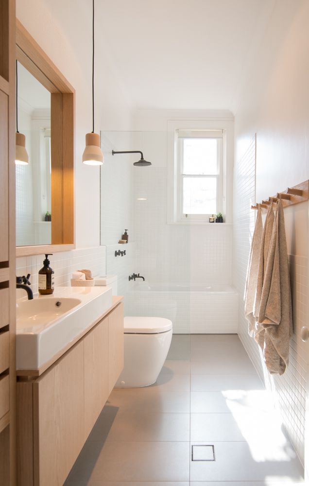 White Minimalist Bathroom Simple Elegance: A Stylish Monochromatic Bathroom Design