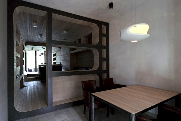 Compact Oak Tube Captures Natural Light for a 5th Floor Apartment .