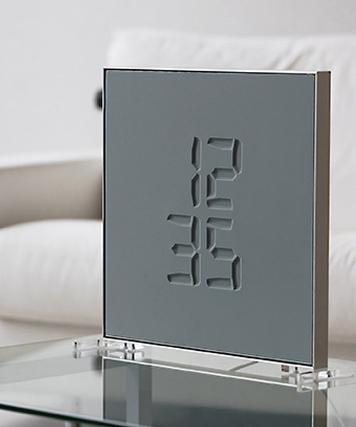 ETCH clock engraves time in a sculptural w