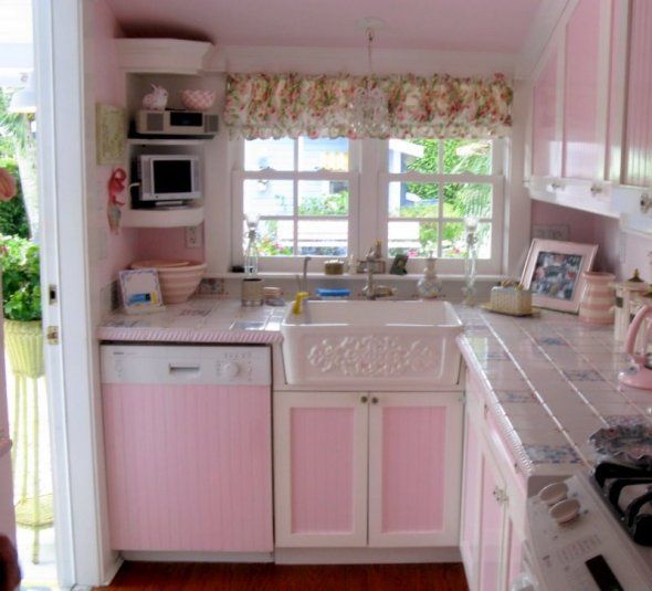 Oh! I just love this little pink kitchen. Look at that sink .
