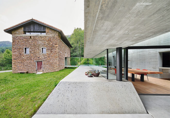 Cave-like Concrete Home Built on the Slopes of Navarre Mountains .