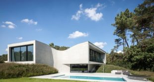Villa MQ With Unique Sloping Architecture - DigsDi