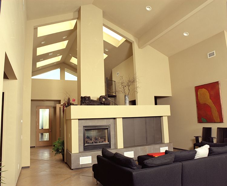 High Vaulted ceilings with large skylights for great lighting .