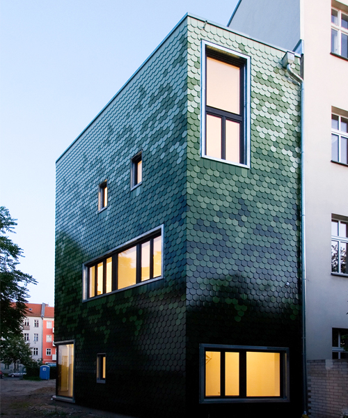 brandt + simon architekten adds green tile façade to berlin ho