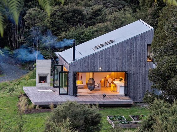 New Zealand's backcountry huts inspired this breezy, open home .