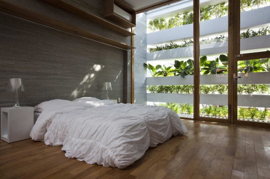 Minimalist Concrete House With A Large Vertical Garden - DigsDi