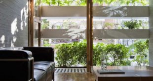 Minimalist Concrete House With A Large Vertical Garden - DigsDi