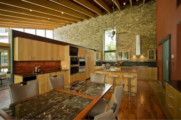 Natural Modern Kitchen, exposed beams, and lots of stone and wood .