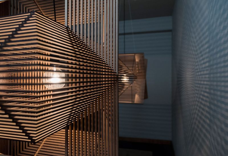 The Angles pendant lamp is perfect harmony of laser-cut wooden .