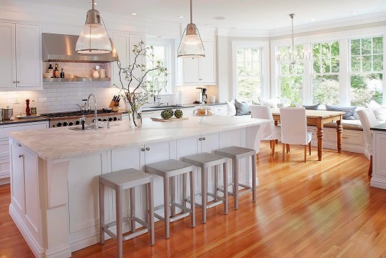 Stunning White Kitchen With A Corner Sofa And Smart Storage - DigsDi
