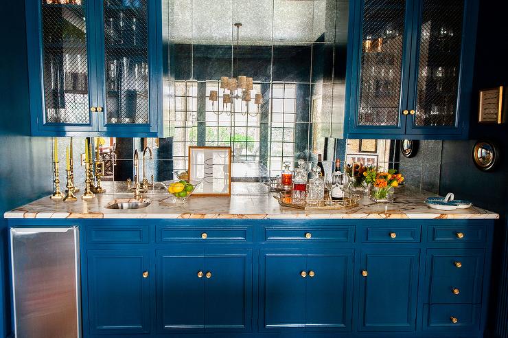 Blue Wet Bar Cabinets with White and Gold Marble Countertop .