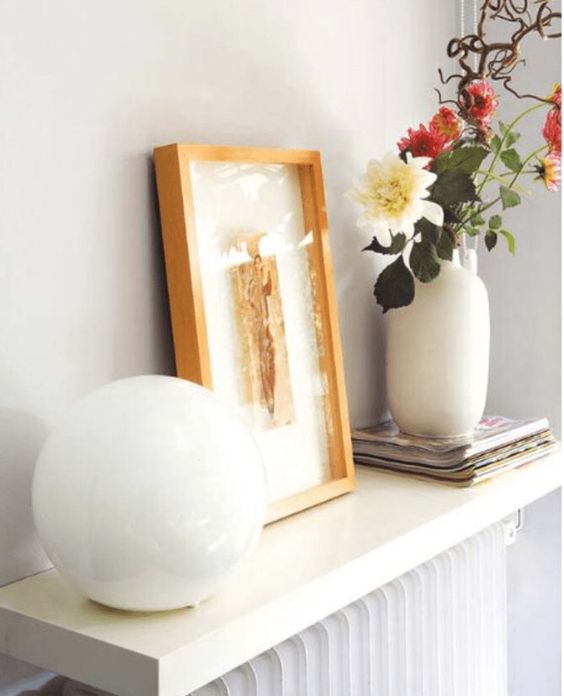 a large shelf over the radiator is ideal to store and display, the combo looks very cohesive and natural