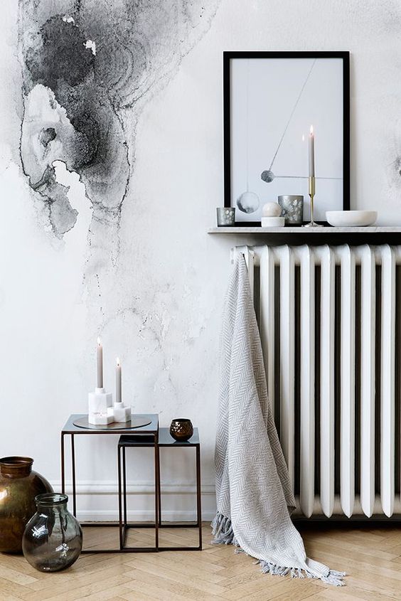 a narrow wall-mounted display shelf above the radiator is a cool idea for a Scandinavian space, it's a smart and cool idea