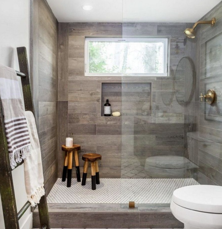 a contemporary bathroom done with mosaic and wood look tiles in the shower to highlight this zone