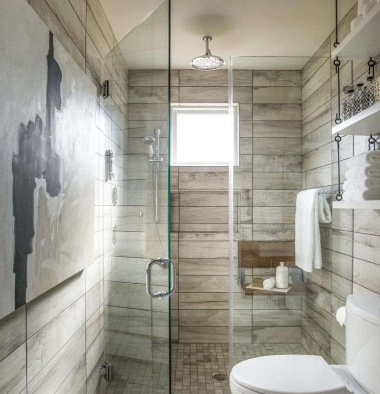 a neutral bathroom done with usual neutral tiles and cool wood plank imitating ones for a soft touch