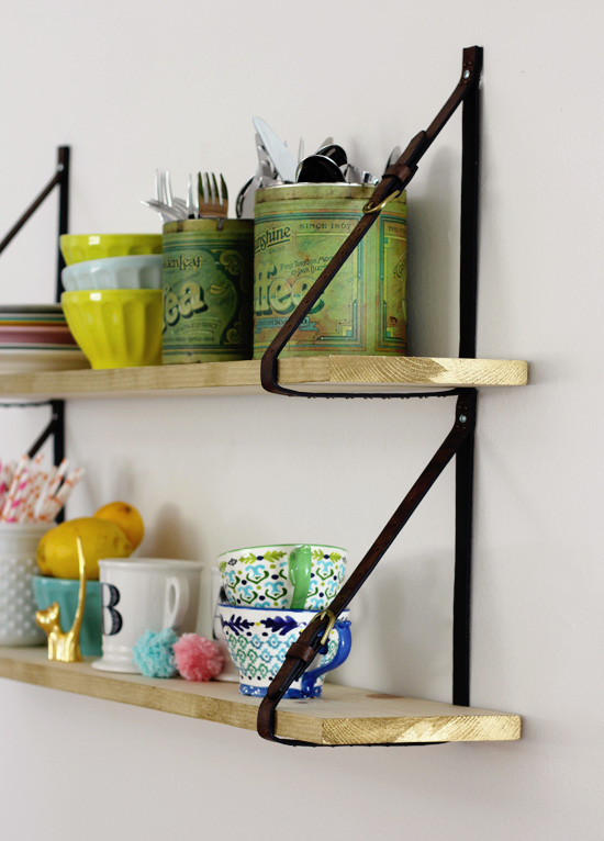Hanging shelf with leather straps
