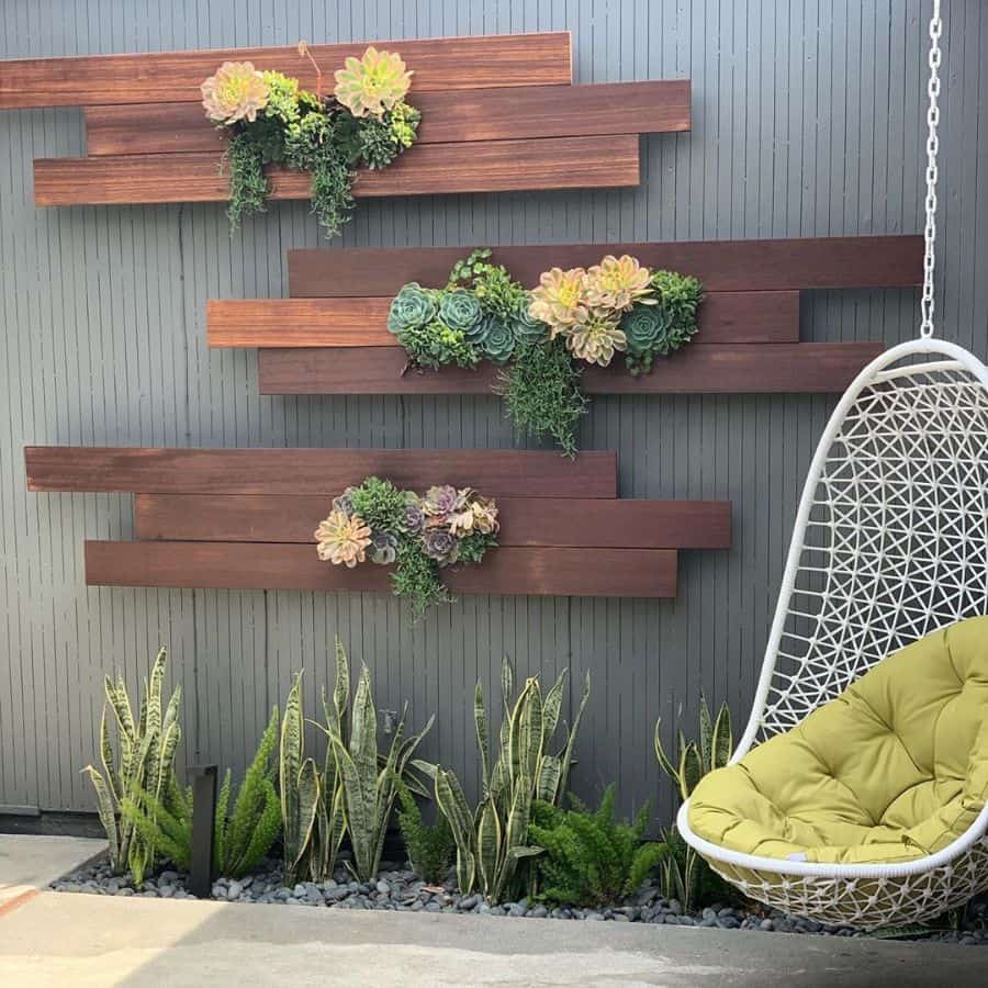 Wood panel wall planters with hanging egg chair with flowers 