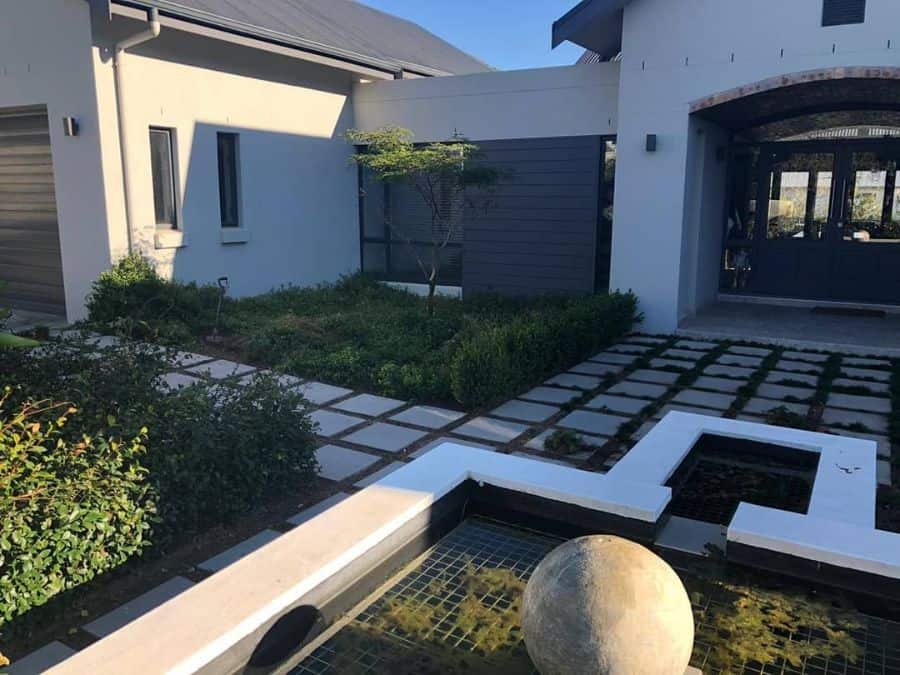Modern water feature made from garden and patio paving stones 