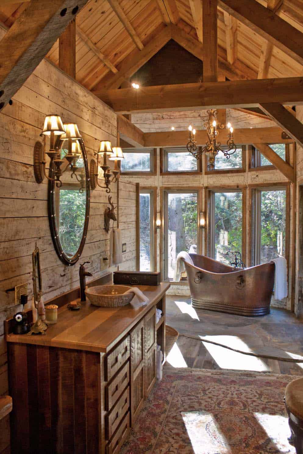 romantic rustic bathroom with stone tub and stone walls